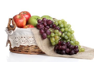 Basket full of apples and juicy grapes