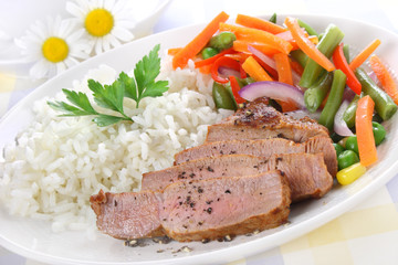 Rice with pork meat and vegetables