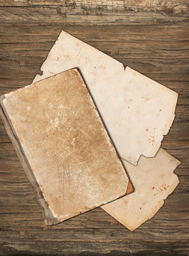 Blank old papers on a wooden background