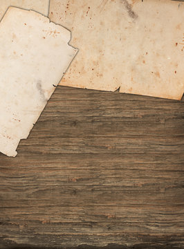 Weathered old papers on a wooden background