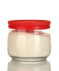Jar with white crystal sugar isolated on white