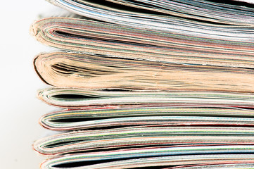 A large stack of magazines piled high.