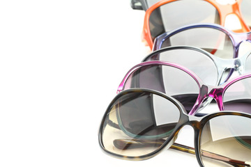 Collection of sunglasses on white background