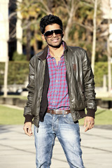 portrait of cool young man with sunglasses, outdoors