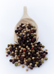 Pepper in wooden spoon