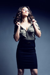 Fototapeta premium woman in military shirt and black skirt