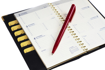 notepad with  spiral and pen on white background