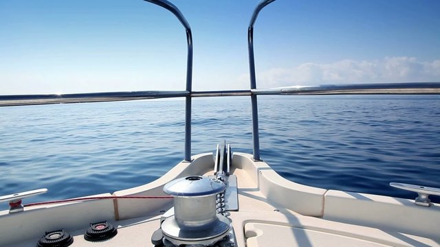 Boating in blue ocean sea view from boat bow deck