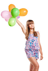 Fototapeta na wymiar Cute teenage girl holding balloons on white