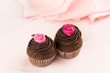 Two chocolate cupcakes