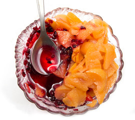 jam in a saucer with a spoon