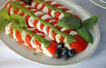 Caprese salad with tomato,mozzarella, bazil and pesto