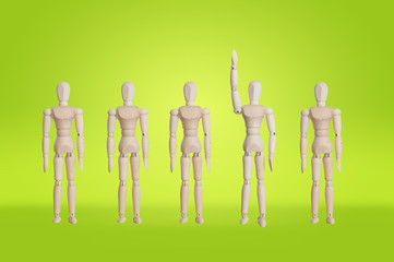 Wooden model in the row of wooden model with hand up idea concep