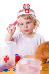 Little girl playing as doctor