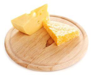 Cheese on cutting board isolated on white