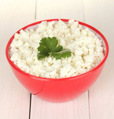 cottage cheese with parsley in red bowl