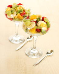 Fresh fruits salad on wooden table
