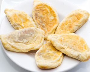 Tasty pies on a white plate