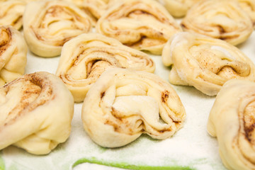 Half-finished product of a roll with cinnamon