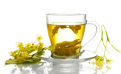 cup of linden tea and flowers isolated on white