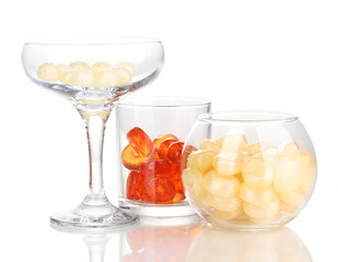 Color candies in glasses isolated on white
