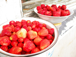 Red strawberry in  tableware