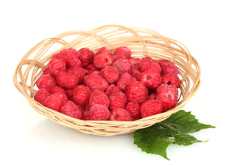 Fresh raspberries in wicker basket isolated on white