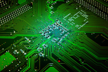 Green glowing computer motherboard abstract background