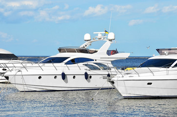 Fototapeta premium White motor yacht over harbor pier, Odessa, Ukraine