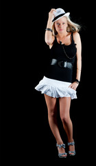 Sexy woman in short white skirt tipping her hat