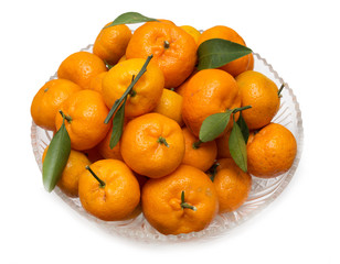 oranges with leaves on a plate