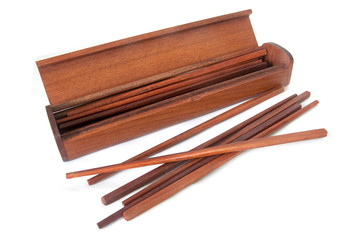 group of chopsticks in wooden bamboo tube