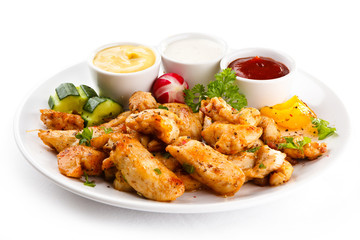 Grilled meat and vegetables on white background