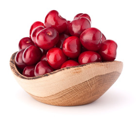 cherry berries in wooden bowl