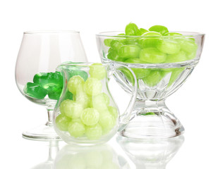 Color candies in glasses isolated on white