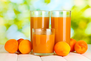 glasses of apricot juice  and fresh apricots