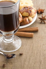 cup of coffee with beans and sweets