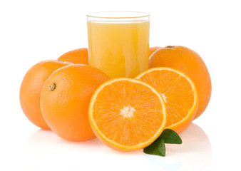 orange juice in glass and slices isolated on white