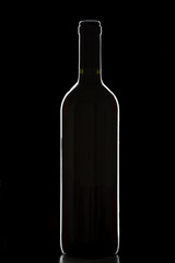 Glass of red wine over black background