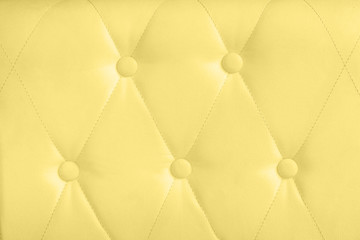 yellow leather with button decorated
