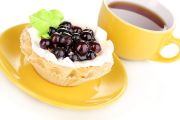 sweet cake with cup of tea isolated on white