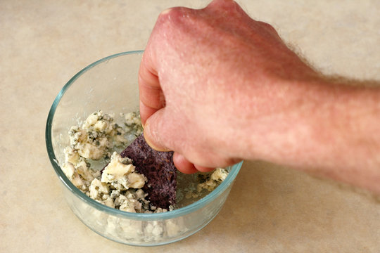 Scooping Blue Cheese Onto Blue Corn Chip