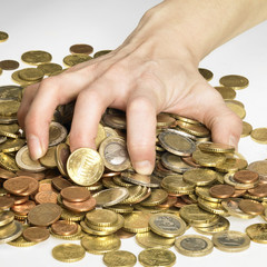 hand while gathering euro coins