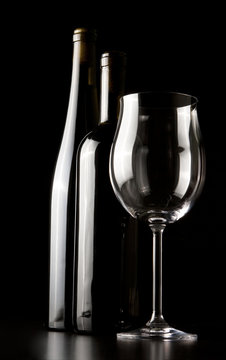 Wine glasses, a black background.