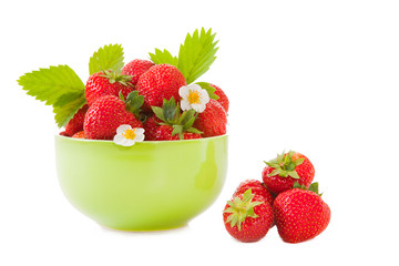 green bowl with fresh strawberry on the isolated white