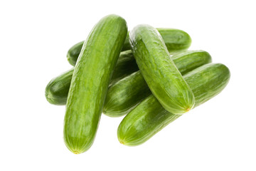 Pile of organic cucumbers isolated on white