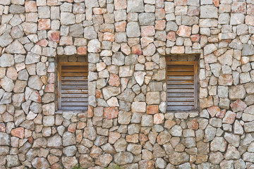 Two windows in the old stone wall