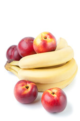 Bunch of bananas and ripe nectarines