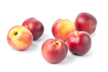 Group of ripe nectarines, isolated over white