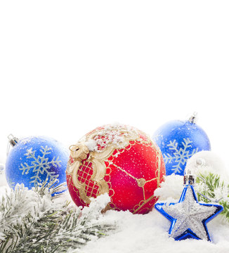 Christmas blue and red baubles on snow background